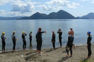 A Hong Kong triathlon team swim training at a recent triathlon camp in Lake Toya
